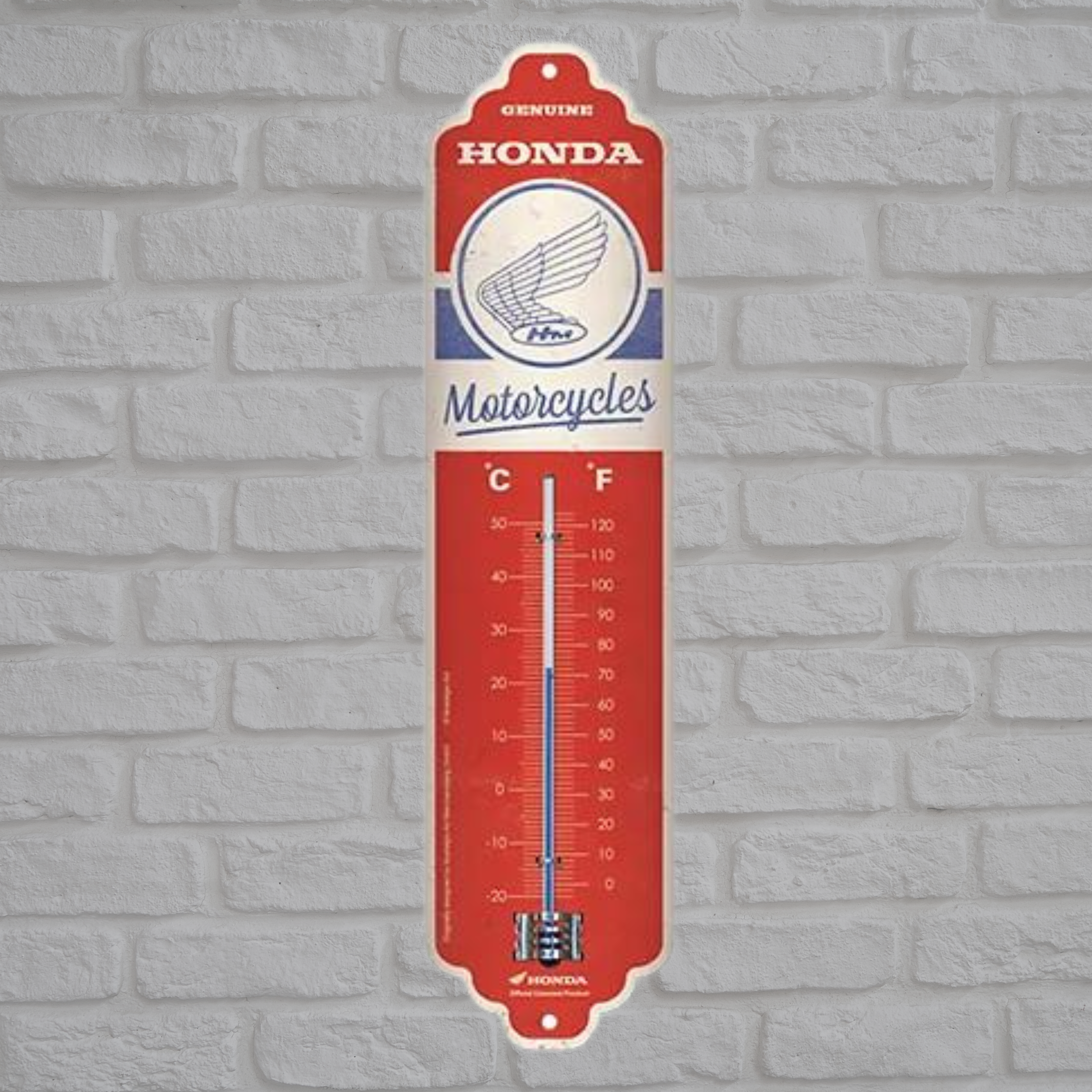 Thermomètre métal de couleur rouge. Marque : Honda.
