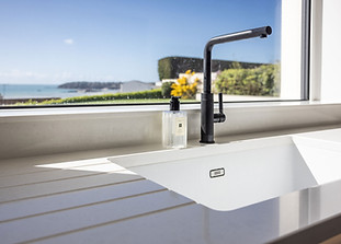 Caesarstone 4600 Organic white worktops, fabricated by Somerville limited the luxury kitch