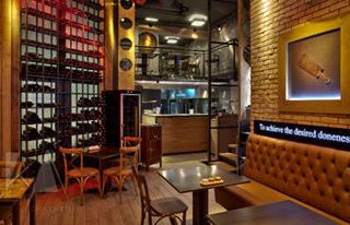 Quality material selection and architectural construction study for a restaurant in Glyfada by Assos Ergo.