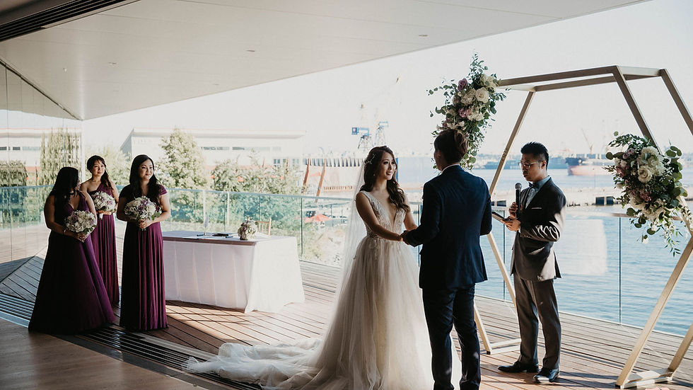 Couple exchanging vows during a Classic Celebration wedding ceremony at Polygon Gallery in North Vancouver, BC.