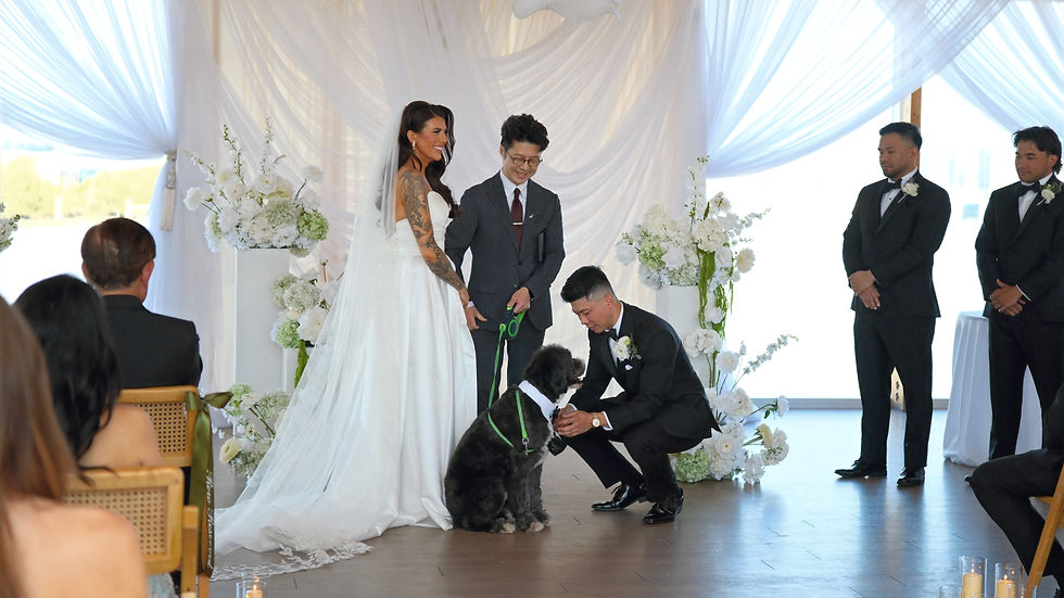 Wedding officiant leading a pet-inclusive wedding ceremony in Vancouver with the couple and their dog participating