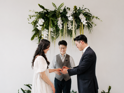 Couple exchanging rings during a private marriage ceremony at The Ensora in British Columbia