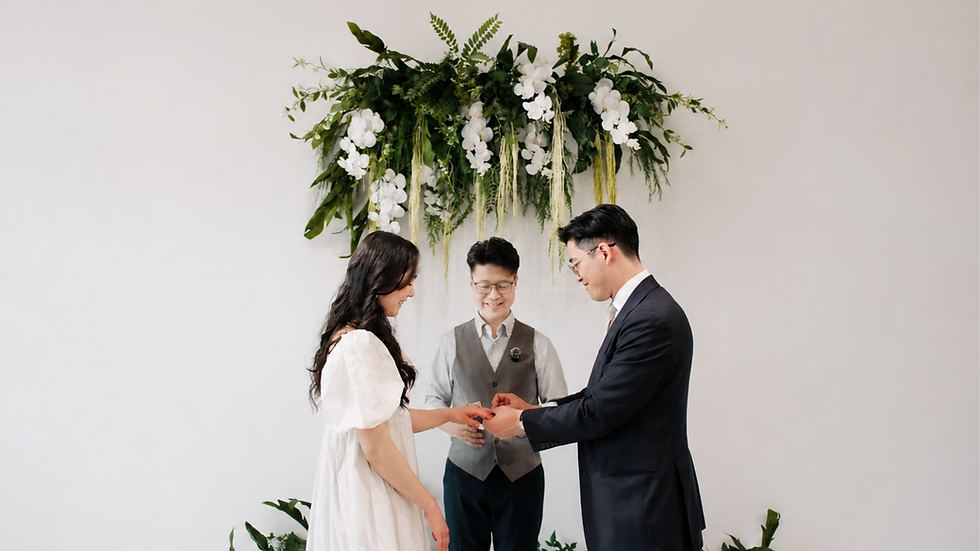 Couple exchanging rings during a private marriage ceremony at The Ensora in British Columbia