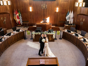 Vancouver City Hall wedding ceremony in Council Chamber with couple and officiant