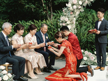 Chinese wedding tea ceremony in Vancouver with bride and groom serving tea to parents during family ritual