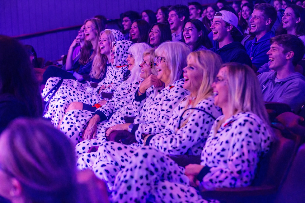 Eye-level view of a comedy stage with a microphone and spotlight