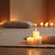 Eye-level view of a peaceful meditation space with candles and cushions.