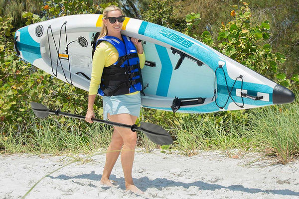 person carrying inflatable kayak
