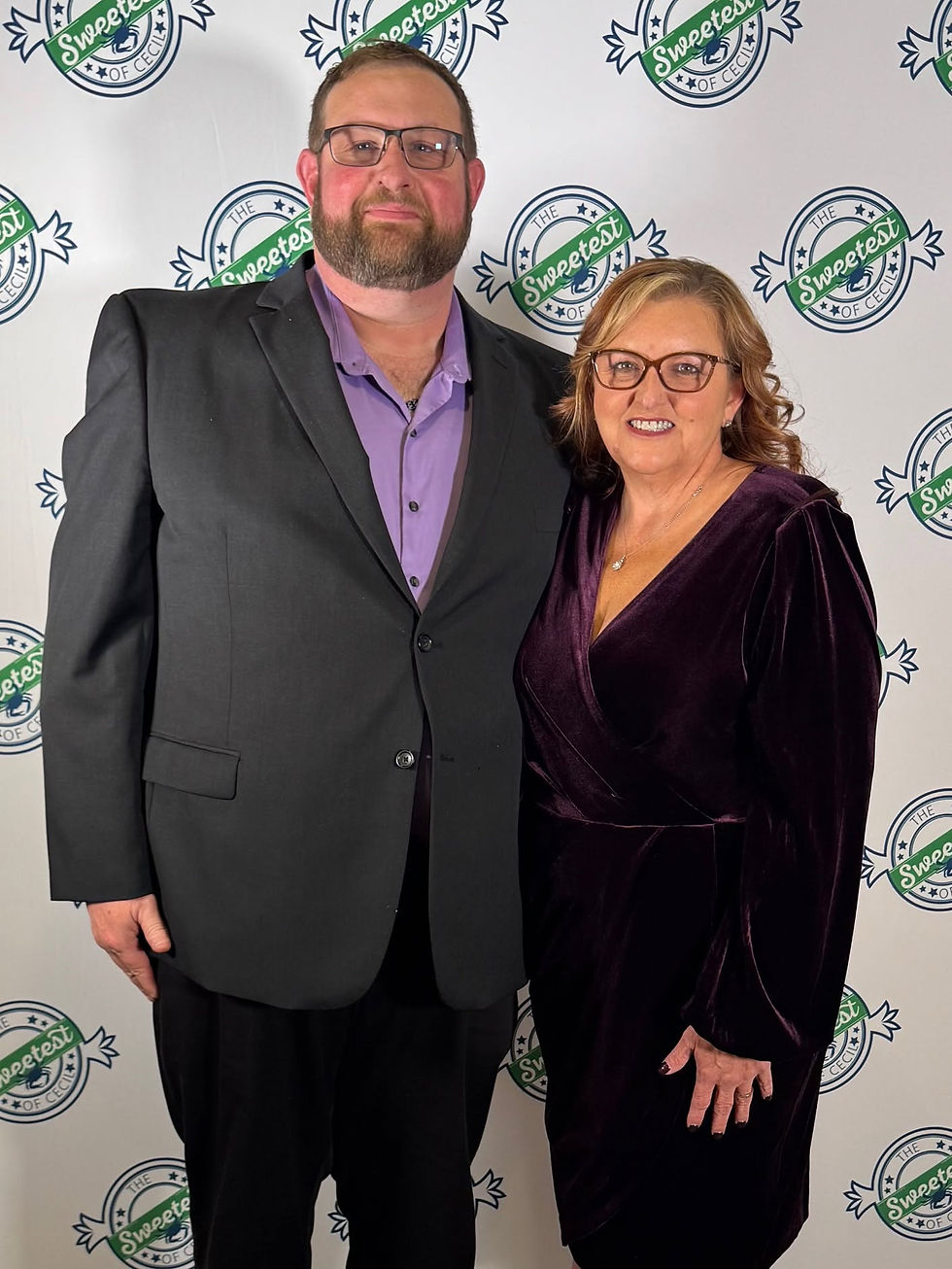 Joyce Bilski smiling with a man in a suit