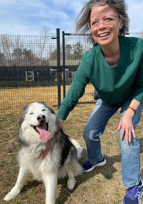 a woman petting Luke the dog