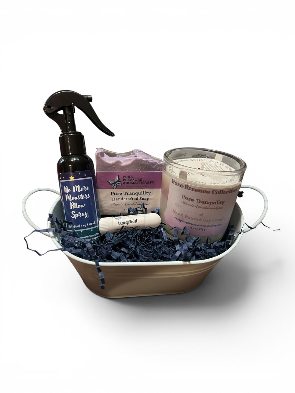spray bottle, soap, candle, and nasal inhaler in a metal tub gift basket
