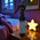 Thumbnail: bottle of no more monsters pillow spray on a night stand in a dimly lit room