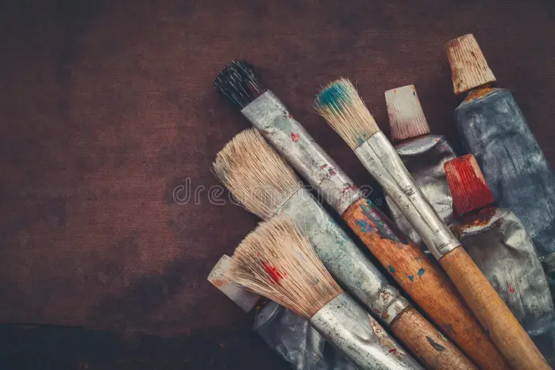 artist-paintbrushes-paint-tubes-closeup-brown-canvas-background-copy-space-text-110232441.