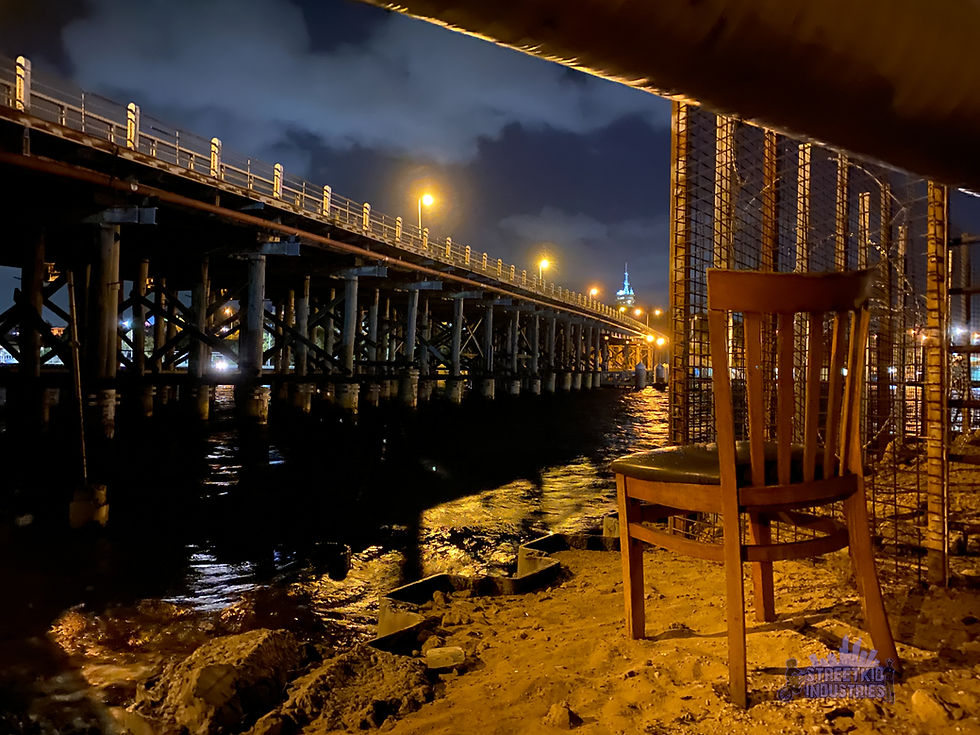 The timber Fremantle Traffic Bridge at night, viewed from the riverbank. Photo © Delphine Jamet, Streetkid Industries.