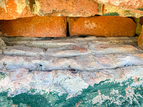 Gaps between the bricks are visible through a hole in the Operations Bunker wall