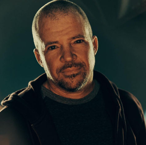 Artist, Benji Cowart posing for a photo shoot.