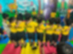 Children in yellow uniforms at Little Life Playway Gallery