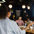 back-view-woman-holding-meeting-work-with-colleagues.jpg