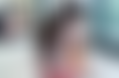 A young woman sitting alone learning not to abandon herself