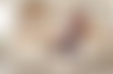 Woman balancing pots and vegetables in the kitchen, symbolizing the mental load and overwhelm of carrying it all alone.