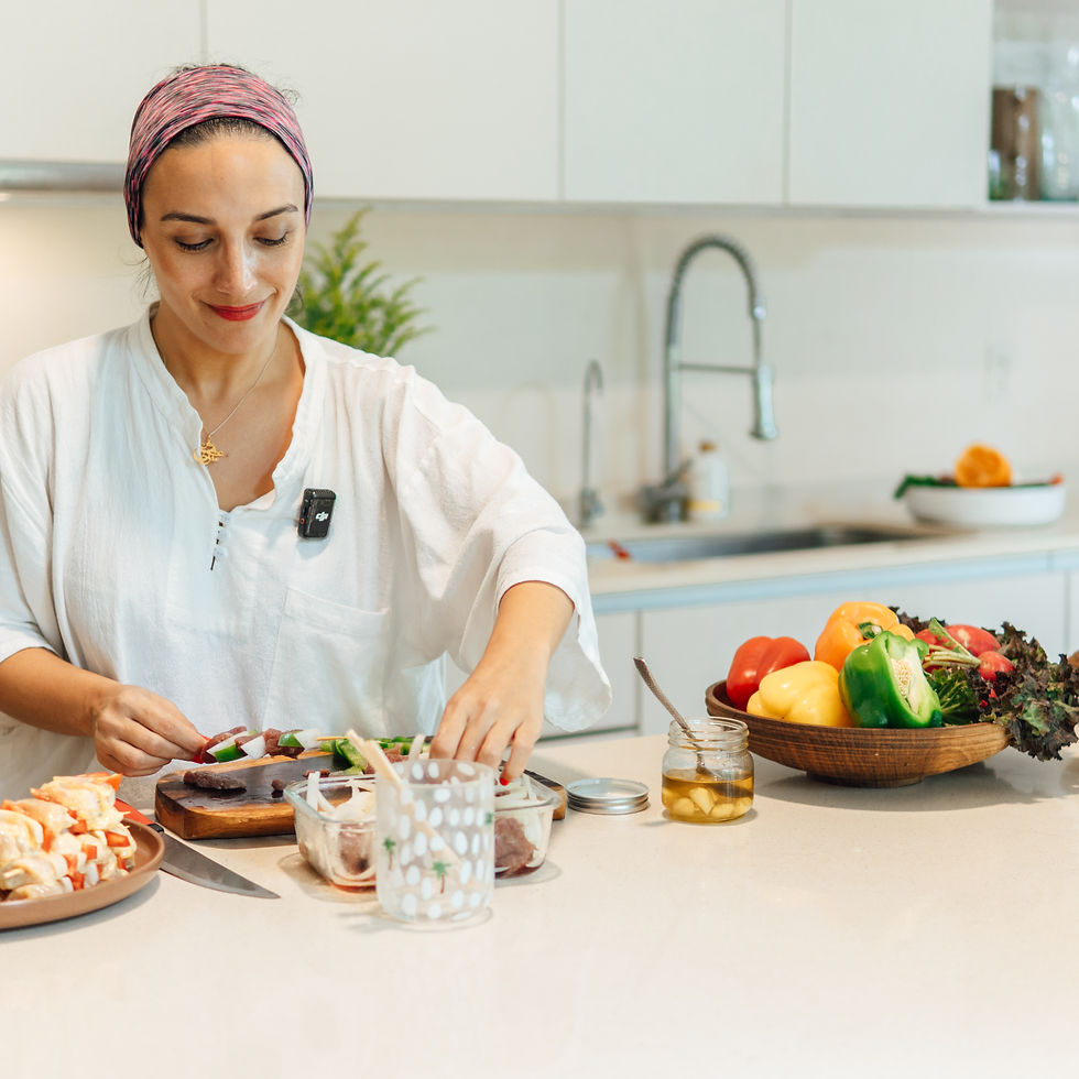 Studio photography of a table laden with a diverse spread of Middle Eastern dishes, suggesting a communal and abundant meal.
