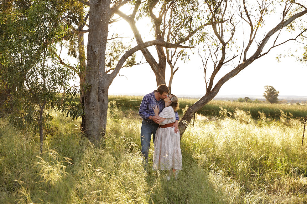 Dad and Mum kissing on the farm