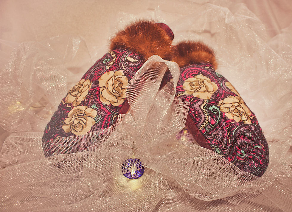 Pair of purple mittens on the table