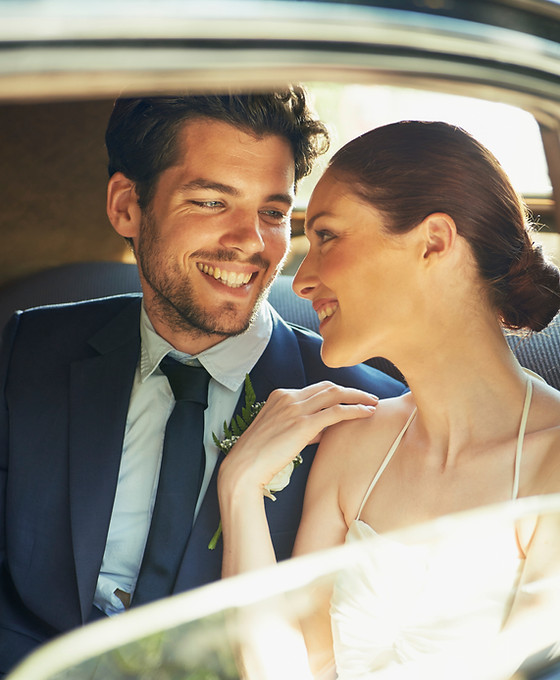 Bride and Groom Through Car Window