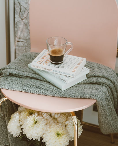 Pink Chair with a stack of books