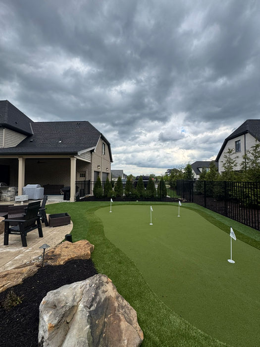 Artificial turf putting green installation for home backyard putting practice