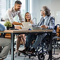 coworkers-conference-table-work-wheelchair-user.jpg