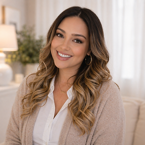 Christa Zummo, licensed marriage and family therapist, smiling in a warm neutral therapy setting.