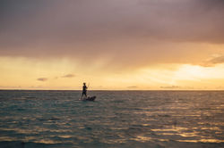 Fisherman is sailing in the distance