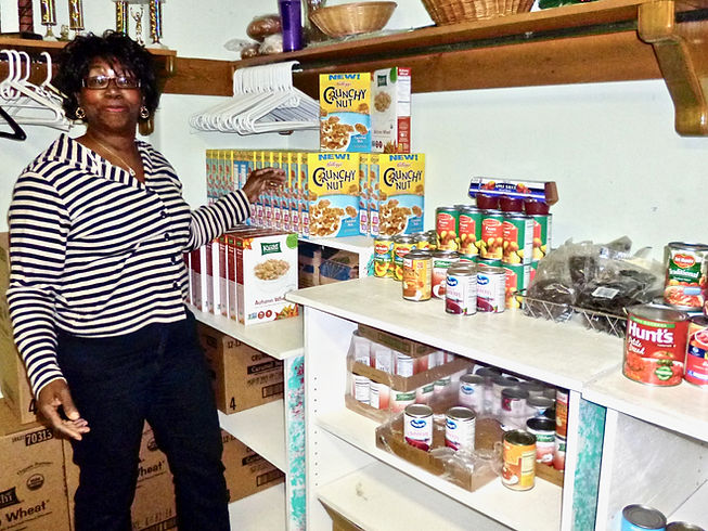 Volunteer ready to hand out cereal and c