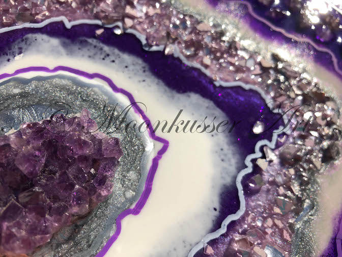 Thumbnail: Geode Resin Wall Art - Geode Amethyst, detail of crushed glass and resin surround two amethyst crystal clusters