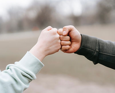 fist bump - pexels-andres-ayrton-6551298 2.jpg
