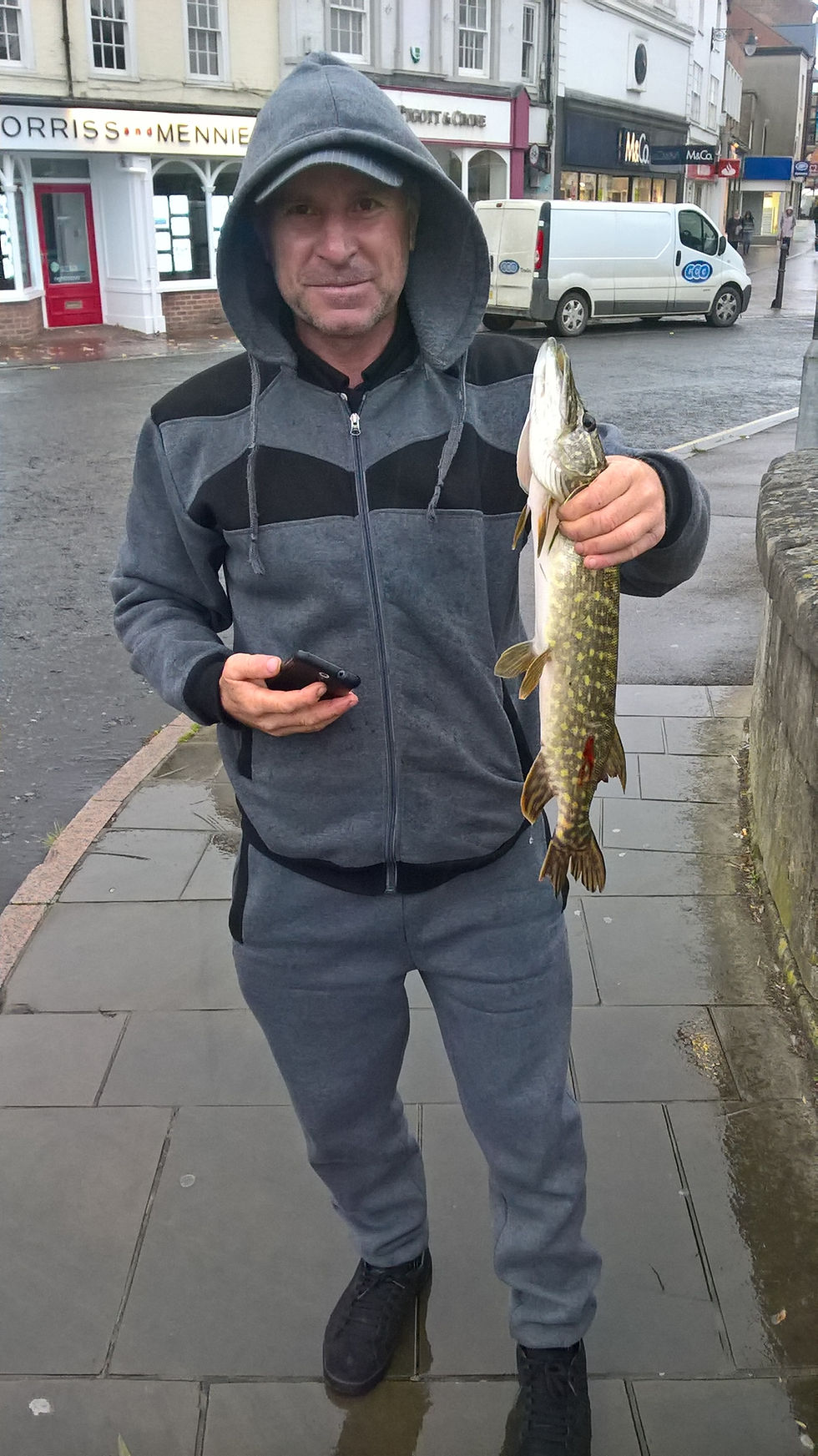 Fisherman with pike