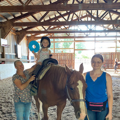 Kayley and Trina assisting as horse leader and side walker
