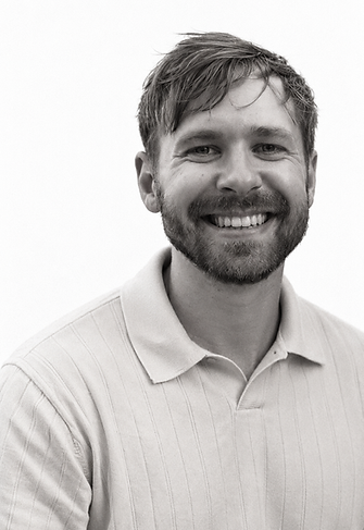 Warmly Smiling Bearded Man Portrait.png