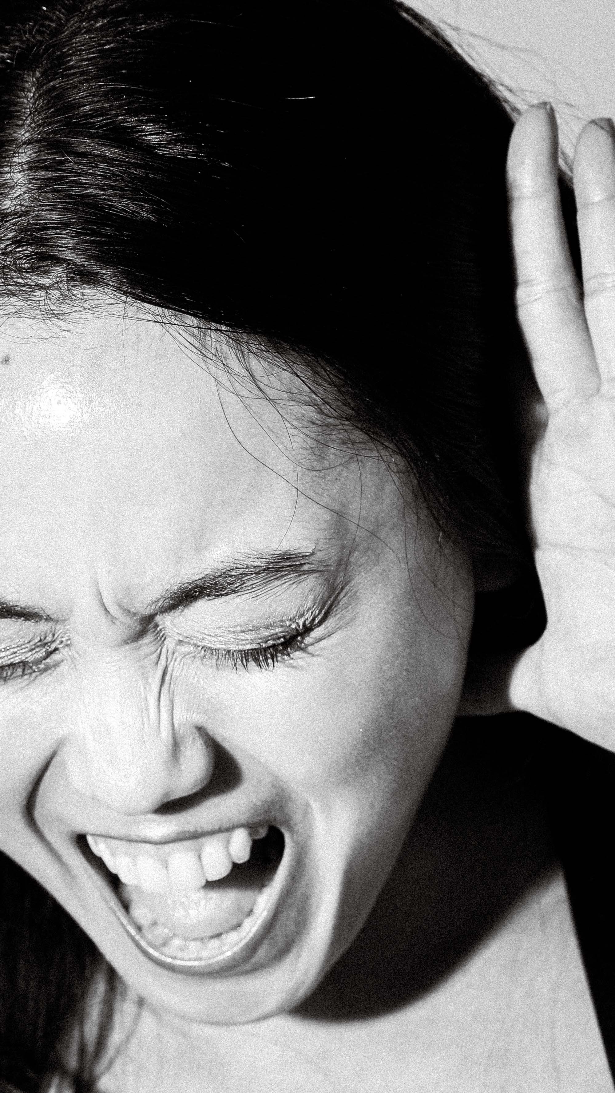 a photography of a girl who is screaming and expressing her frustration