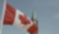 Canadian flag in front of Parliament building