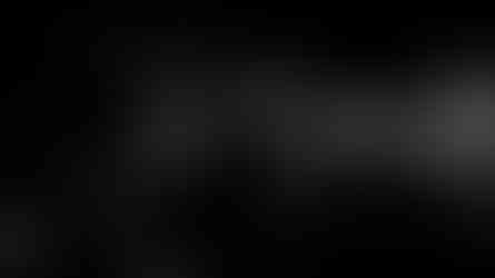 Expressive woman laughing with hands near face