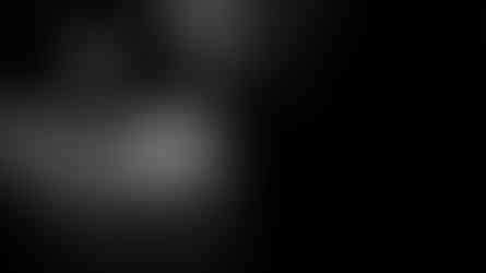 Black and white portrait of person with dreadlocks