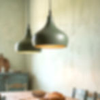 Morning bell Green ceramic pendant lighting over kitchen island in rustic setting