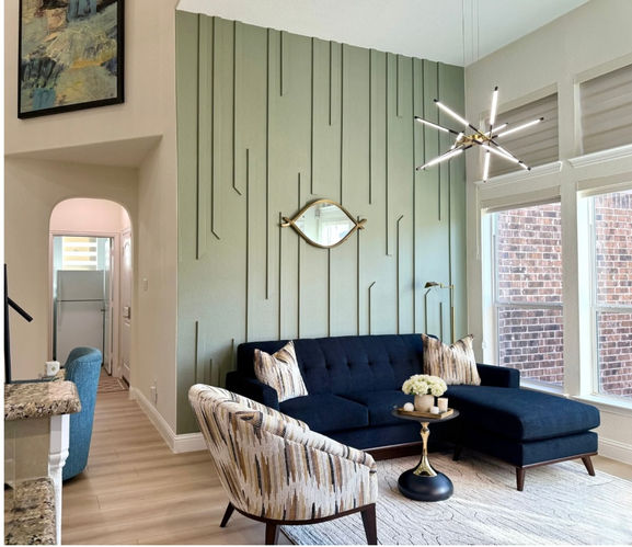Lounge entrance with accent wall and navy seating