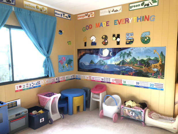 Baby dolls and play kitchen.