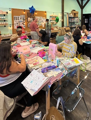 people making art at a table