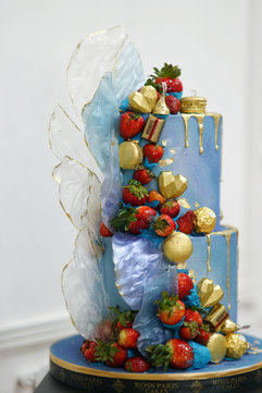 2 tier Birthday Cake with fresh strawberries and chocolates