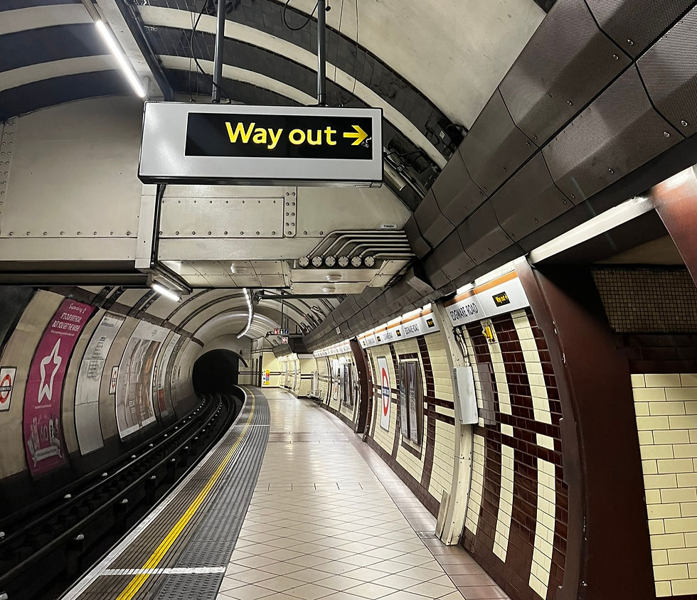 a sign sayign way out directing people out of the underground