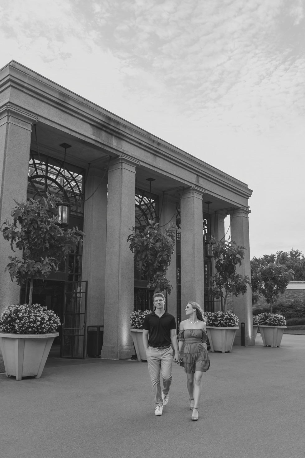 couple in garden for engagement pictures